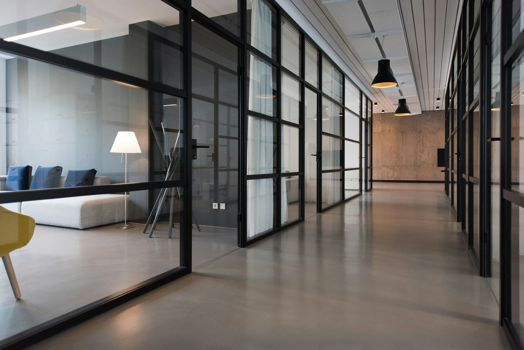 Modern office with glass meeting rooms and an open workspace